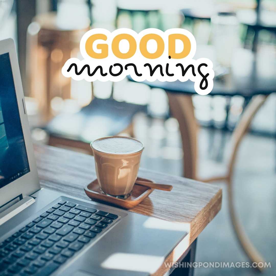 Coffee cup, laptop in coffee shop. Good Morning Coffee Images